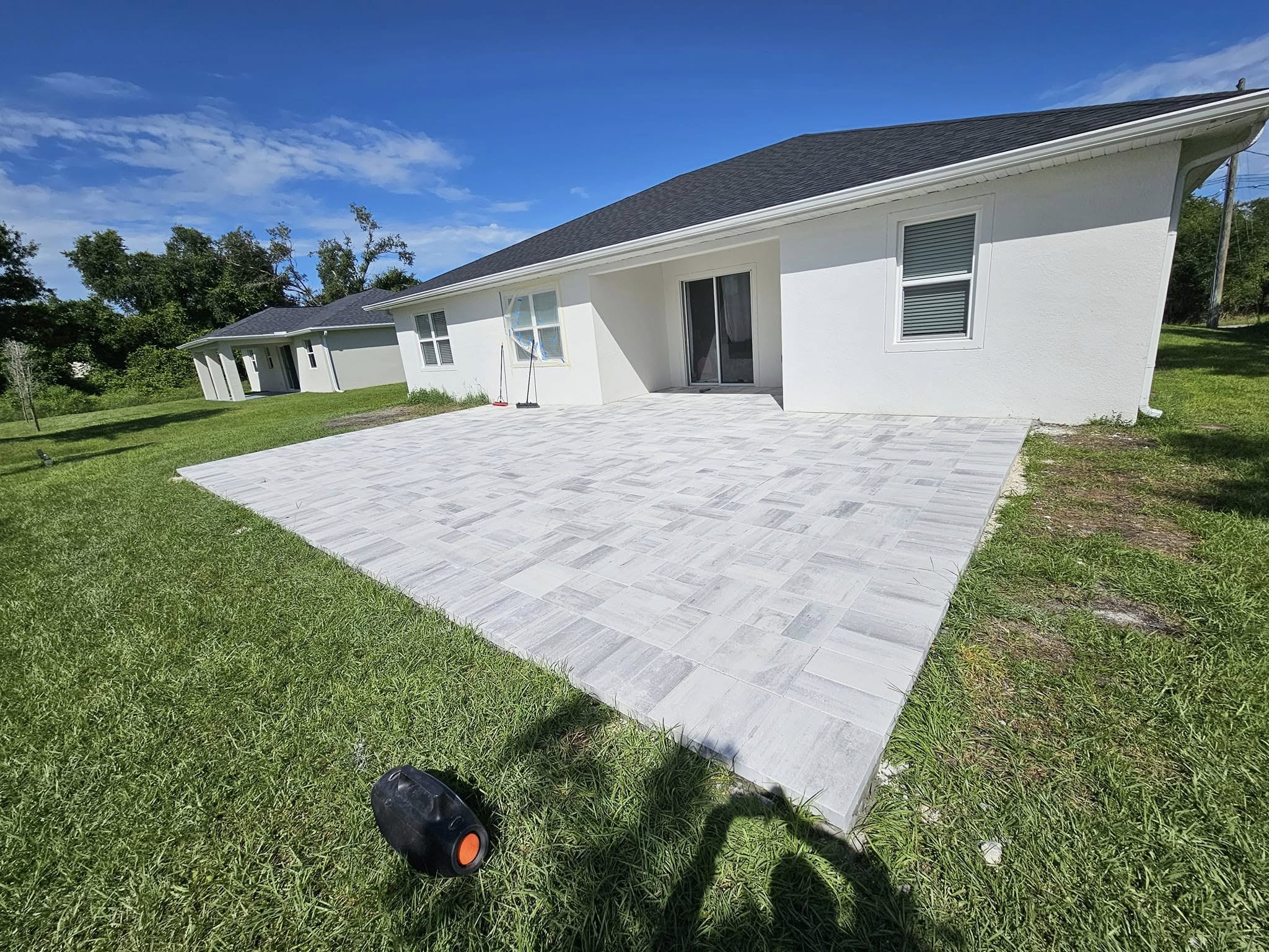 Finished patio with custom pavers, showcasing a clean and polished design for a stylish outdoor space.